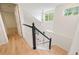 Staircase with natural light and hardwood flooring at 424 Arbor Dr, Lafayette, CO 80026