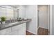 Bright bathroom boasts granite countertops, white cabinetry, and modern fixtures at 360 S Estes St # C, Lakewood, CO 80228