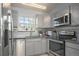 Bright kitchen featuring stainless steel appliances, modern finishes and natural light at 360 S Estes St # C, Lakewood, CO 80228