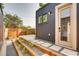 Backyard featuring a door to the garage with modern gravel and stone landscaping at 3439 N High St, Denver, CO 80205