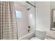 Stylish bathroom with white subway tile, shower-tub combo, and sleek fixtures for a minimalist design at 3439 N High St, Denver, CO 80205