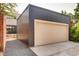 External view of the garage with modern siding and landscaping at 3439 N High St, Denver, CO 80205