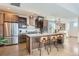 Modern kitchen with stainless steel appliances, a center island with seating, and sleek cabinetry at 3439 N High St, Denver, CO 80205