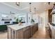 Modern kitchen with a large center island, sleek countertops, and open floor plan flowing into the living room at 3439 N High St, Denver, CO 80205