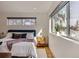 Bright and sunny main bedroom, hardwood floors, a window, and bedside table, creating a cozy retreat at 3439 N High St, Denver, CO 80205