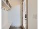 Mudroom with a coat rack, bench, and a view of the home's smart lock entry at 3439 N High St, Denver, CO 80205