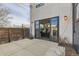 Outdoor patio space featuring large sliding glass doors leading into the home's living area at 3439 N High St, Denver, CO 80205