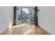 Bright room features hardwood floors and sliding glass doors that lead to a balcony at 3439 N High St, Denver, CO 80205