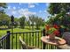 Relaxing balcony with a golf course view, complete with patio furniture and decorative lights at 2945 W Riverwalk Cir # B, Littleton, CO 80123