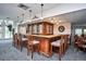 Bar area with seating, wooden bar and glass display perfect for gatherings at 2945 W Riverwalk Cir # B, Littleton, CO 80123
