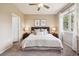 Comfortable bedroom with a queen bed, soft lighting, and minimalist decor at 2945 W Riverwalk Cir # B, Littleton, CO 80123