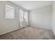 Neutral bedroom with a small window and plush carpeting at 2945 W Riverwalk Cir # B, Littleton, CO 80123