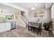 Dining area with a small table, seating for four, and floating shelves at 2945 W Riverwalk Cir # B, Littleton, CO 80123