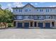 Attractive multi-story townhomes with stone accents and private garages for residents at 2945 W Riverwalk Cir # B, Littleton, CO 80123