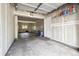 Spacious two car garage offering plenty of room for storage, overhead door, and concrete flooring at 2945 W Riverwalk Cir # B, Littleton, CO 80123