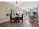Open floor plan featuring a dining area that flows seamlessly into a sunlit living space at 2945 W Riverwalk Cir # B, Littleton, CO 80123