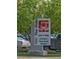 RTD Park-n-Ride sign for Littleton/Downtown Station surrounded by lush trees and parked cars at 2945 W Riverwalk Cir # B, Littleton, CO 80123