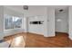 Open living area with hardwood floors and modern lighting at 1387 Sunnyside St, Highlands Ranch, CO 80126