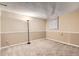 Neutral-toned basement featuring updated carpet, fresh paint, and modern lighting fixtures at 367 Jupiter Dr, Lone Tree, CO 80124