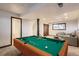 Spacious finished basement with a pool table, providing an ideal space for recreation and entertainment at 367 Jupiter Dr, Lone Tree, CO 80124