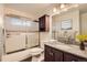 Bathroom featuring a granite vanity, dark wood cabinet, a shower with glass door, and modern fixtures at 367 Jupiter Dr, Lone Tree, CO 80124