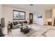 Bright living room with a large window and a cozy seating arrangement, offering a comfortable and inviting atmosphere at 367 Jupiter Dr, Lone Tree, CO 80124