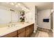 Bathroom features double vanity, framed mirror, and walk-in shower at 8165 E Lowry Blvd # 310, Denver, CO 80230