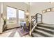 Bright dining area with large windows and modern staircase at 8165 E Lowry Blvd # 310, Denver, CO 80230