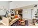 Cozy living area with fireplace, staircase, and open layout at 8165 E Lowry Blvd # 310, Denver, CO 80230