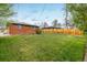 Large, well-maintained backyard featuring a green lawn and privacy fence at 740 Lotus Way, Broomfield, CO 80020