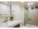 Bathroom with a glass-enclosed shower and a modern sink at 740 Lotus Way, Broomfield, CO 80020