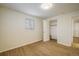 Bright bedroom with hardwood flooring, closet, and neutral walls at 740 Lotus Way, Broomfield, CO 80020