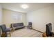 Cozy bedroom featuring a futon, two chairs, and a comfortable carpet at 740 Lotus Way, Broomfield, CO 80020