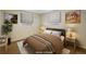 Serene bedroom featuring wood floors, soft lighting, and neutral paint creating a relaxing retreat at 740 Lotus Way, Broomfield, CO 80020