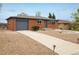 Charming brick home with concrete driveway and front yard landscaping at 740 Lotus Way, Broomfield, CO 80020
