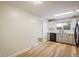 Bright kitchen features updated cabinetry, lighting, and appliances at 740 Lotus Way, Broomfield, CO 80020