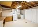 Spacious laundry room with washer, dryer, utility sink, cabinets, and storage at 740 Lotus Way, Broomfield, CO 80020