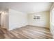 Spacious living room features wood-look flooring and neutral walls at 740 Lotus Way, Broomfield, CO 80020