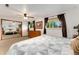 Bedroom with a large closet, ceiling fan and modern furniture at 6798 Depew St, Arvada, CO 80003