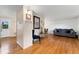 Open-concept living room featuring hardwood floors, neutral walls, and comfortable seating. Perfect for relaxation at 6798 Depew St, Arvada, CO 80003