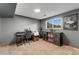 A tidy office features a desk, chair, and window with natural light at 6798 Depew St, Arvada, CO 80003