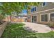 Well-maintained backyard featuring a patio, lush lawn, and a privacy fence at 7838 W Layton Way, Littleton, CO 80123