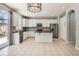Spacious kitchen with white cabinets, stainless steel appliances, and a functional center island at 7838 W Layton Way, Littleton, CO 80123