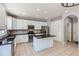 Modern kitchen with stainless steel appliances, granite countertops, and a functional center island at 7838 W Layton Way, Littleton, CO 80123