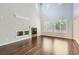Open living room with tall ceilings, hardwood floors, and a fireplace, perfect for entertaining at 7838 W Layton Way, Littleton, CO 80123