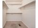 Well-organized walk-in closet with neutral carpet, wire shelving, and ample storage space at 7838 W Layton Way, Littleton, CO 80123