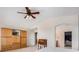 Spacious bedroom with carpet floors, ceiling fan and a doorway leading to the Primary bath at 15901 E 106Th Way, Commerce City, CO 80022