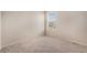 Bedroom with carpet floors and window with natural light at 15901 E 106Th Way, Commerce City, CO 80022