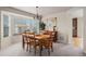 Traditional dining room with a bay window, chandelier, and seating for six at 15901 E 106Th Way, Commerce City, CO 80022