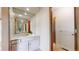 Bathroom featuring a vanity with an expansive mirror and glass enclosed shower at 23 Carla Way, Broomfield, CO 80020